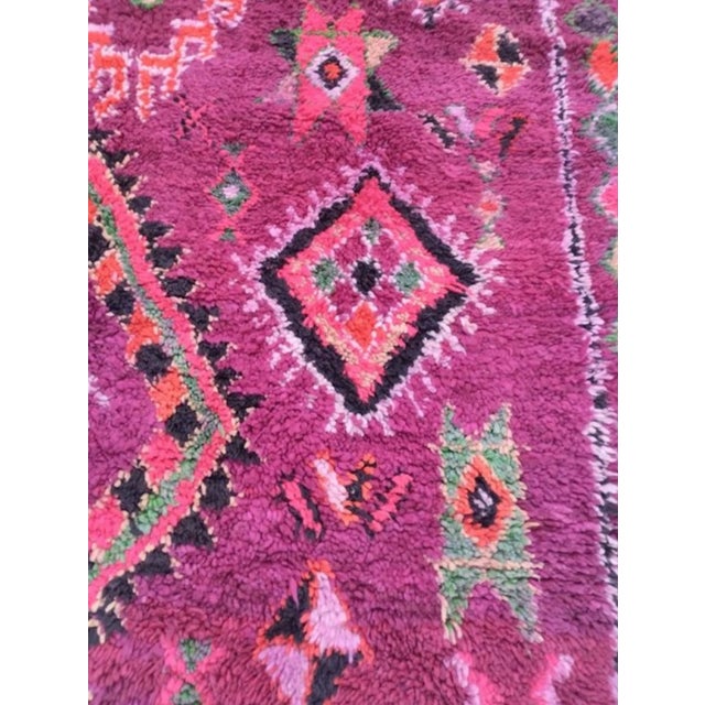 A large hand-knotted Boujaad rug woven by Berber women in Morocco's Boujaad region, in the Middle Atlas foothills. The...