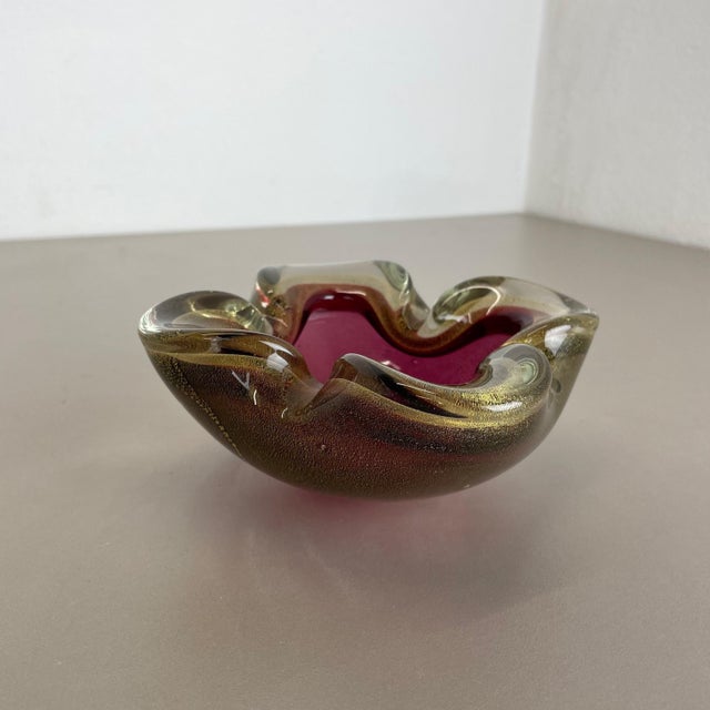 This original vintage glass bowl element, ash tray was produced in the 1970s in Murano, Italy. It is made in high quality...