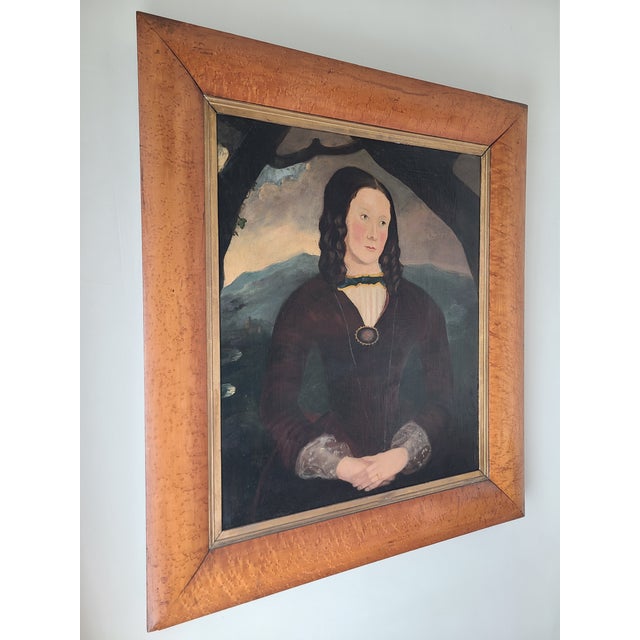 Charming 19th century folk art portrait in the style of William Mathew Prior (1806-1873) depicting a woman in a dark gown...