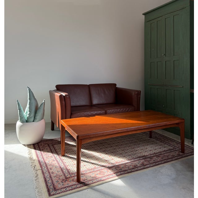 Henning Kjærnulf for Vejle Mobelfabrik (stamped to underside). Solid teak coffee table with subtle and nuanced details....
