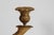 Antique tall empire style 3-armed floor candelabra made of a combination of gilded and brown-patinated metal and bronze....