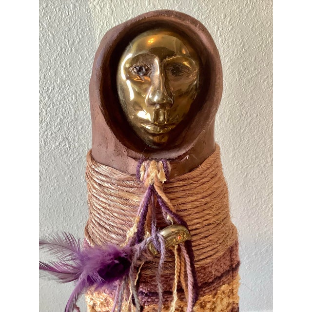 A compelling mixed media figurative sculpture by American artist Naida Seibel, signed at the base and created as part of a...