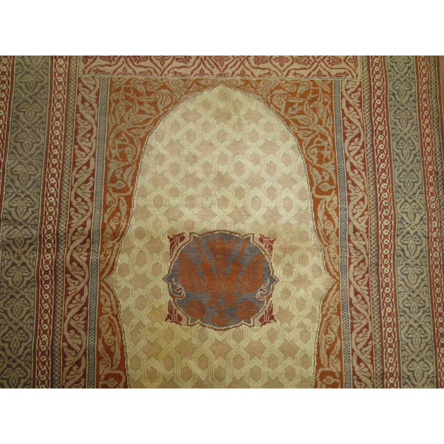 A one of a kind small finely woven turkish rug. We can also see this piece be used as a wall covering. 4'3" x 5'10"