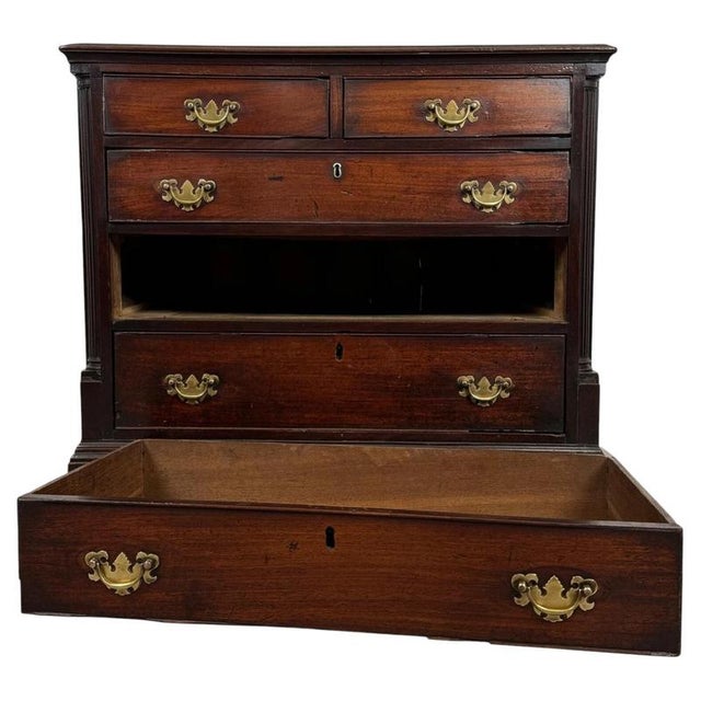 A fine and unusually compact 18th-century English chest of drawers, beautifully crafted in mahogany and distinguished by...