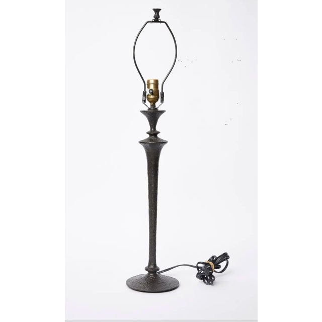 Lovely hammered patinated bronze table lamp in the style of Diego Giacometti. This lamp is cast in bronze it's not just a...