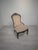 A unique Victorian-style armchair, captivating with its elegant form, rich ornamentation, and timeless character. A...