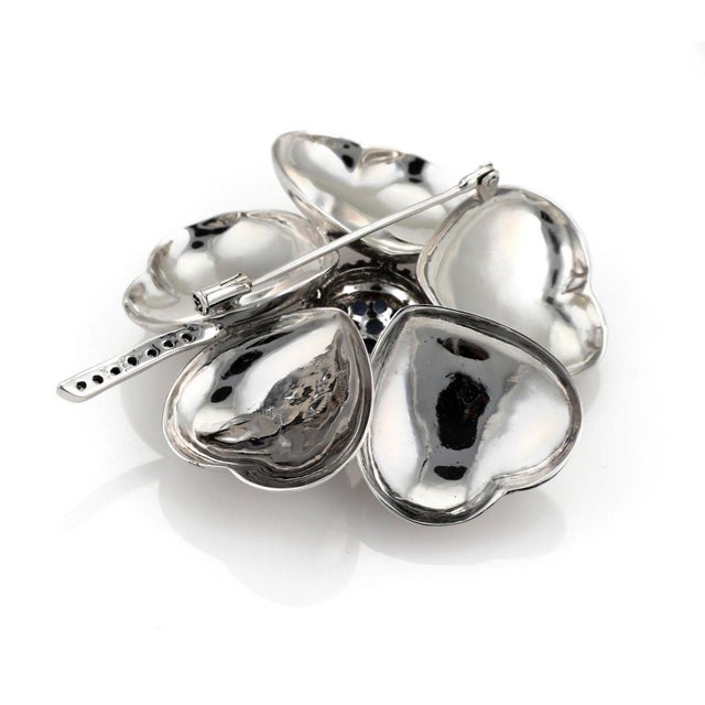 This is a gorgeous large brooch, it is crafted from 14k white gold with a high polished finish, the piece features a large...