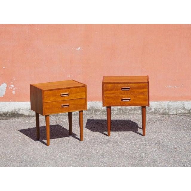 Original teak nightstands in the Mid-Century Modern (MCM) style. Featuring two spacious drawers with milled handles and...