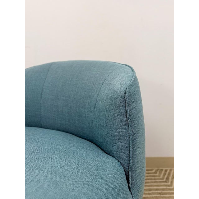 This clean and comfortable modern blue upholstered accent chair is a practical and good-looking seating find. The rich...