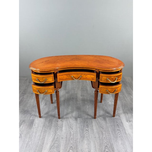 An elegant louis xvi style lady's writing desk, dating from the 19th century. the desk features a beautifully curved shape...