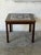This square coffee table features a robust, clean-lined silhouette with an inset top. The surface showcases beautifully...