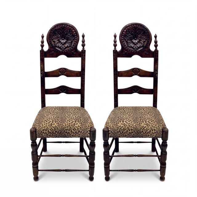 This is a pair of 19th century French baroque style carved oak side chairs with leopard upholstery. The backs have a...