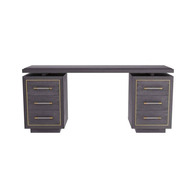 Our Deco-inspired Wixom desk is lavished with rich detail. Created in ebony oak, the striking executive desk is designed...