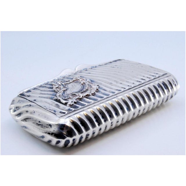 Wavy-Shaped Silver Snuff Box with Monogram Medallion Lid, in Very Good conditions. Designed from 2000 This piece has an...