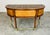 A rare and beautiful Demilune desk in the manner of Henredon having walnut top bordered and accented with olive burlwood...