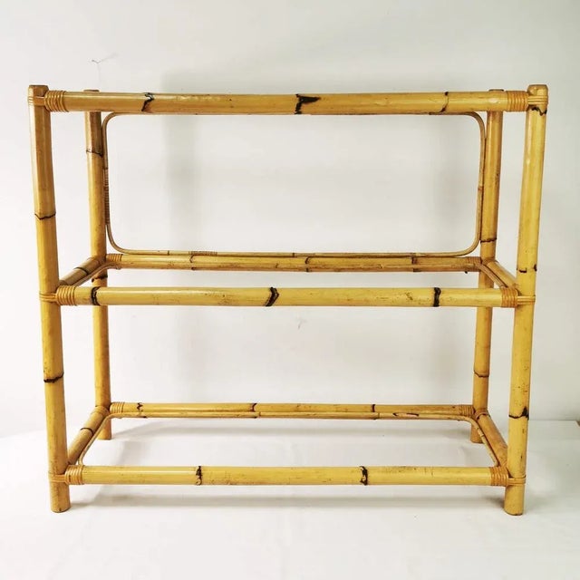 Stand, origin Germany, 1970s It is characterized by spaciousness. Made: construction - bamboo, shelves - toughened glass,...