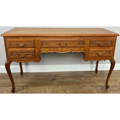 A charming Vintage French Louis cabinet showcasing elegant craftsmanship and timeless French design. The piece features...