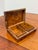 Design Plus Gallery presents a Burl Wood Hinged Keepsake Box. This rectangular box has a highly figured grain pattern,...