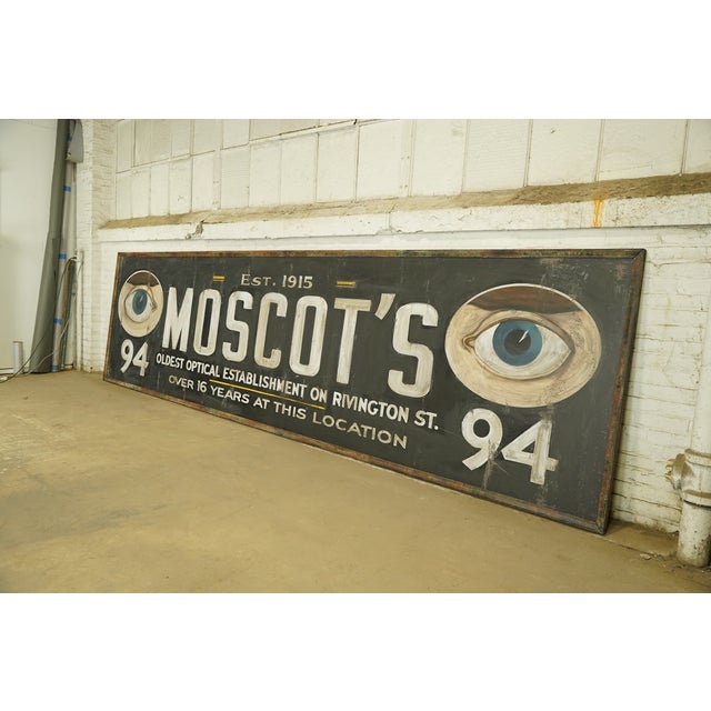 Reclaimed movie set sign made of aluminum in black, white, blue, brown, and yellow colors. The sign reads "Est. 1915,...