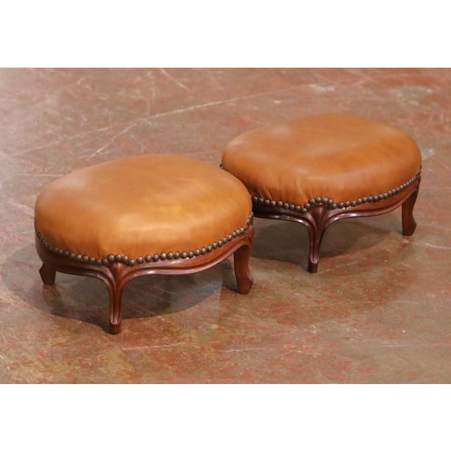 This refined pair of antique French footstools was crafted circa 1880 and showcases the elegant curves and lightness...