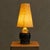 A 1960s French ceramic table lamp by Georges Pelletier, finished in deep midnight blue glaze layered with shimmering gilt...