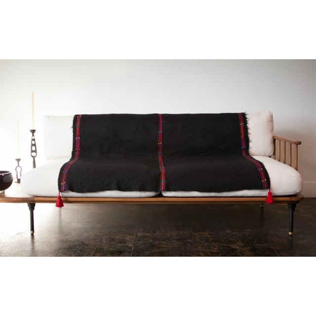 Woven on backstrap looms in Chamula, Chiapas, the textile of this delightful throw is made 100% from wool sheared from...