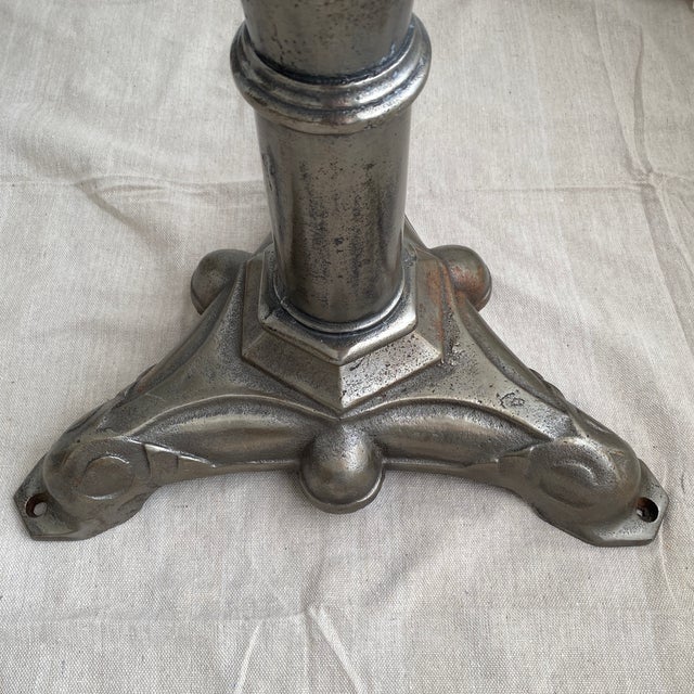 Vintage garden bistro table with a lovely cast iron base in silver finish topped with solid marble. The marble top is not...