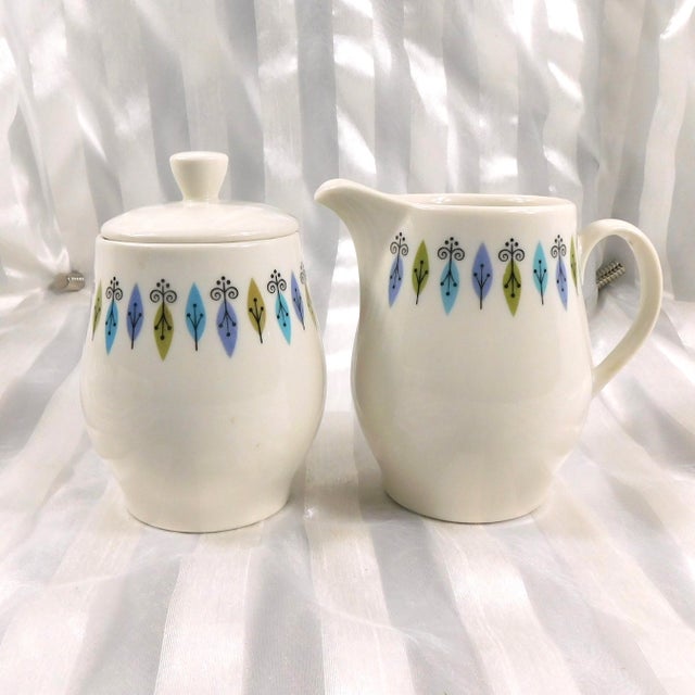 This is a five piece set by Syracuse in the Nordic pattern from 1966. The set includes a creamer, a sugar bowl and lid and...