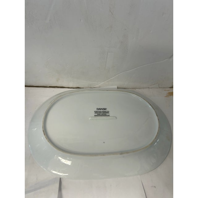 Beautiful colors and detail on this Dansk tray. Would look great in any modern or traditional interior. The floral motif...