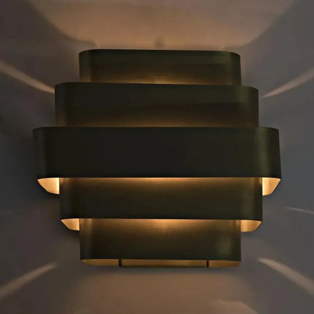 Simple, sculptural, elegant. The handcrafted Baas sconces are available in your choice of antique silver or antique brass...