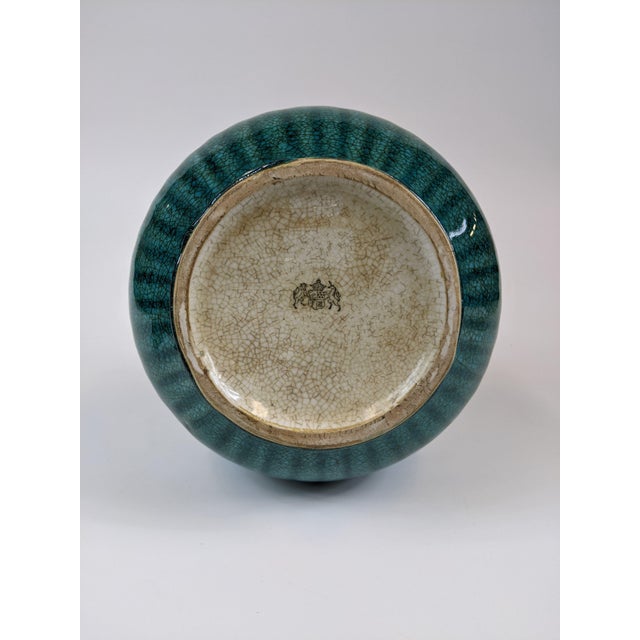 Porcelain turquoise fluted vase with ormolu brass details and stand.