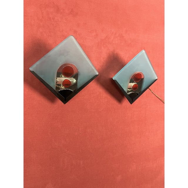 Set of 2 Murano glass wall lamps, 1970s Metal structure, halogen lamp. Glasses intact. Delicious expressions of the 70s....