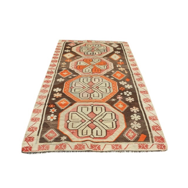 Decorative handwoven vintage kilim rug from Kars region of Turkey. Approximately 50-60 years old. In very good condition.