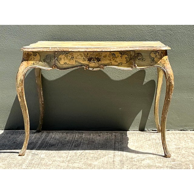 This exquisite vintage Italian writing desk is a stunning celebration of Venetian Rococo artistry, bringing the...
