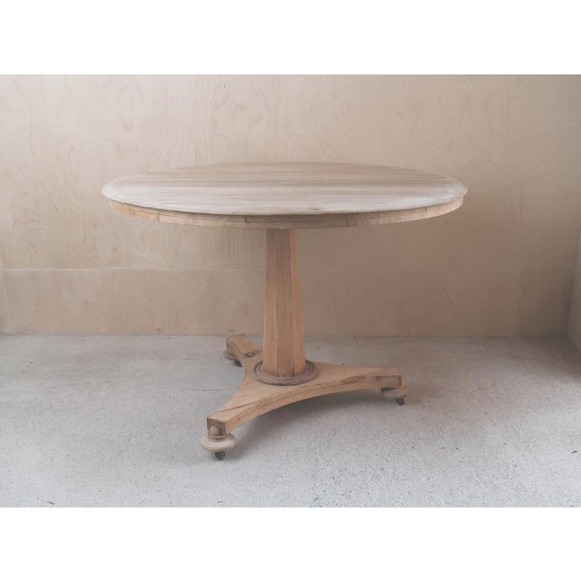 Fabulous small round table. Made from bleached tropical hardwood and pine Original castors