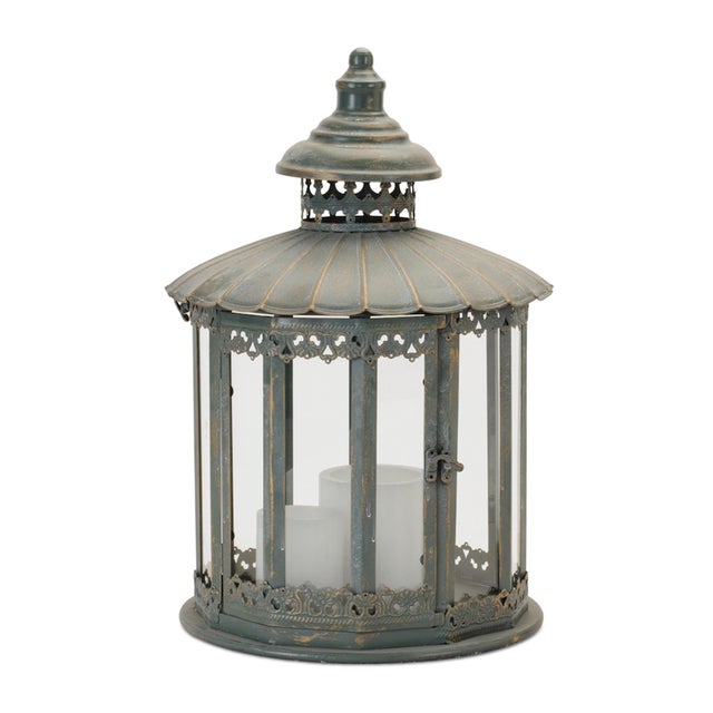 Add timeless elegance to your home with the Ornate Round Brushed Metal Lantern. Standing at 20" tall, this lantern...