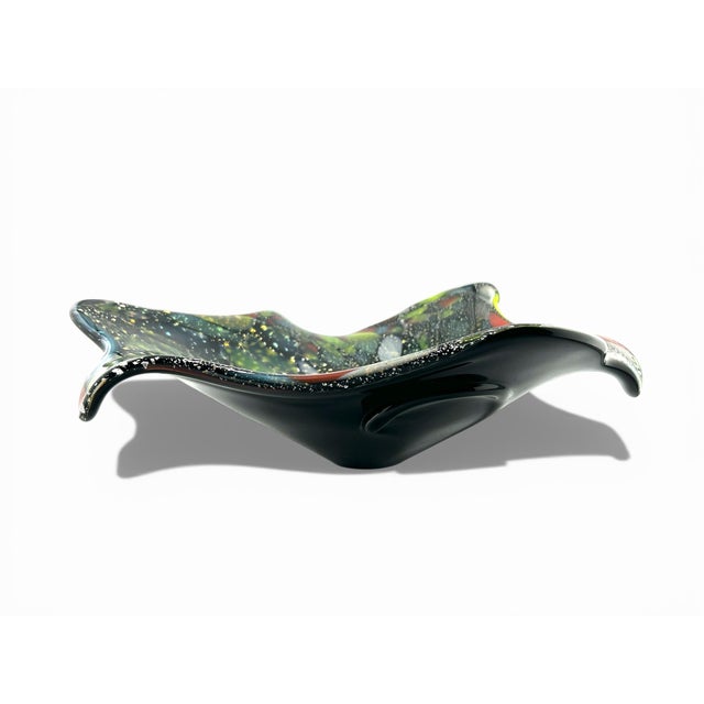 Stunning free form art glass bowl- unmarked, in the style of Murano. Multicolored glass frit with specks of silver and...