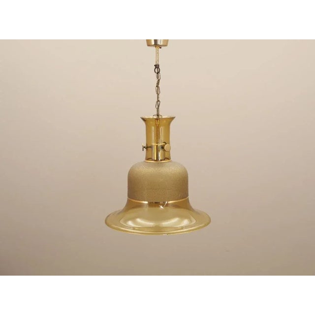 The lamp was made in the 1960s, Danish production. Made of glass and metal. The unique construction is not only a design...