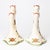 A sweet pair of earthenware candelabra from Rörstrand's "Daldansen" series, each hand-painted with folk dancers in...