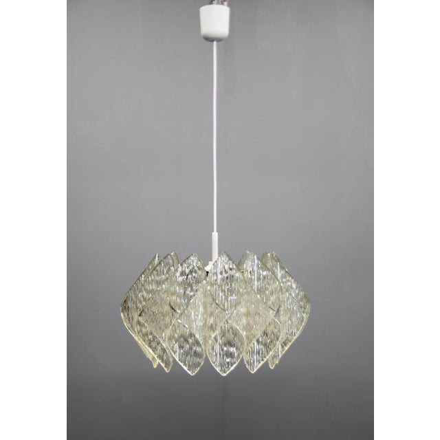 Mid-Century chandelier made in 1960s in Czechoslovakia. Resin and glass shade. Very good original condition. 1x40W,...