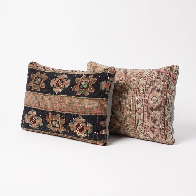 This 16'' x 24'' pillow cover set was made from authentic Turkish rug pieces — dark charcoal ground with faded floral...