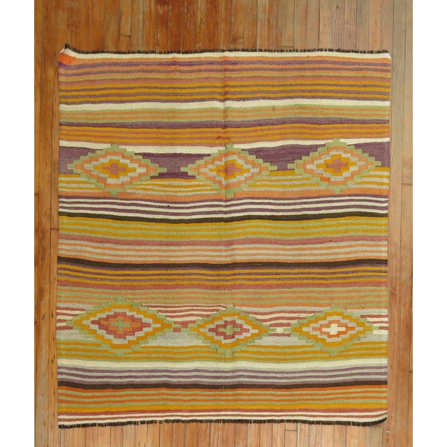 A square size vintage Turkish Kilim with a colorful striped design throughout. 5' x 5'3''