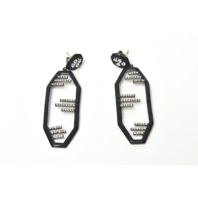 This is part of Chairish’s Costume Jewelry assortment. These stunning pair of period yet modern English art deco dangle...