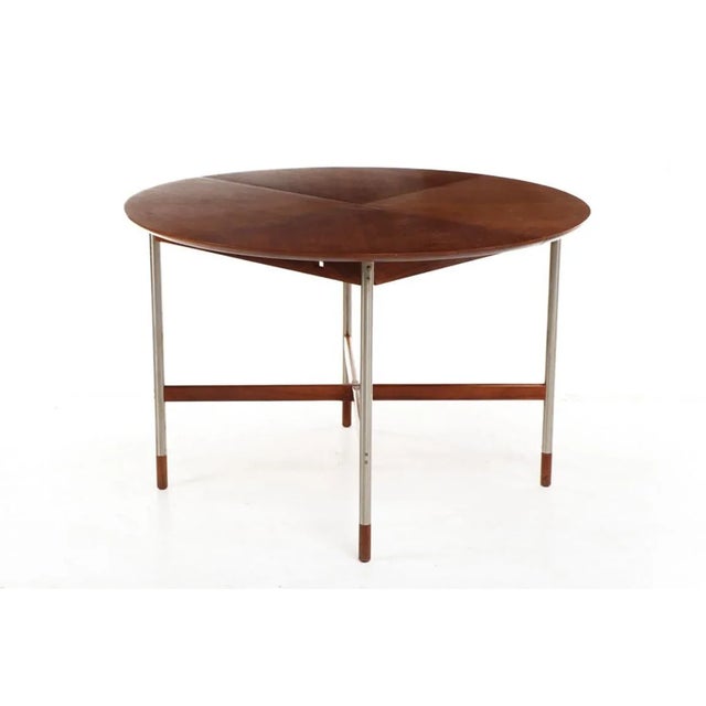 Fantastic small dining table attributed to Arne Vodder for Sibast, Denmark. Walnut top, X-form stretchers and sabots....