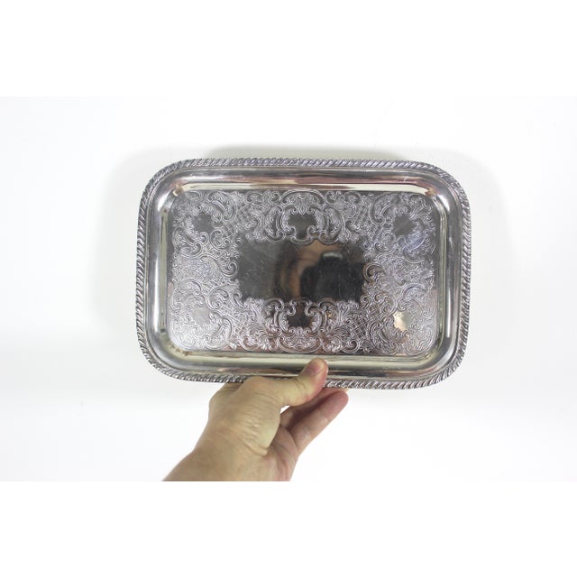 Vintage rectangular silver plated tray with an embossed base and rope edge. Very useful to hold items at the door or to...