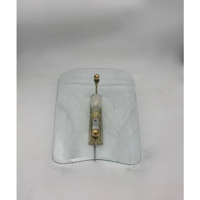 Pair of wall lights from around the 1950s in good condition; very beautiful, light glass, probably the classics of Fontana...