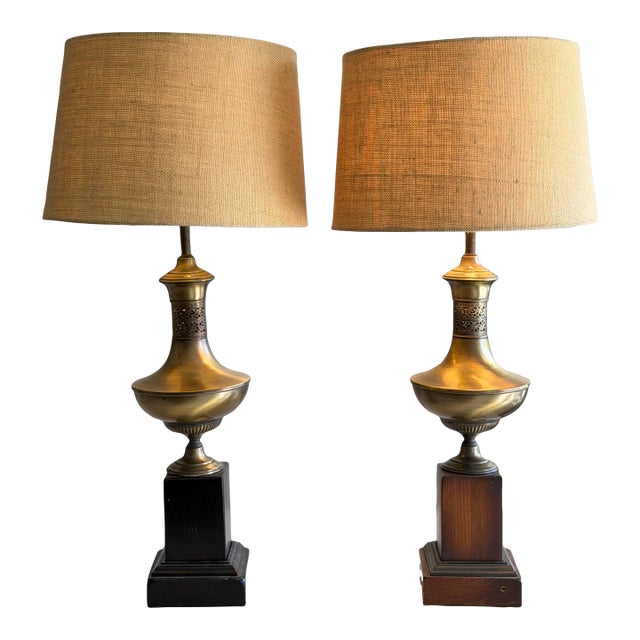 1970s Pair of Neoclassical Brass Urn Table Lamps on Wood Bases With Linen Shades in Style of Maison Jansen / James Mont For Sale
