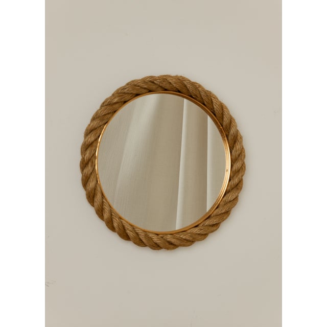 1960s Audoux Minet round wall mirror with twisted rope and a gilt brass inner ring. Mirror glass is clean, minor fraying...