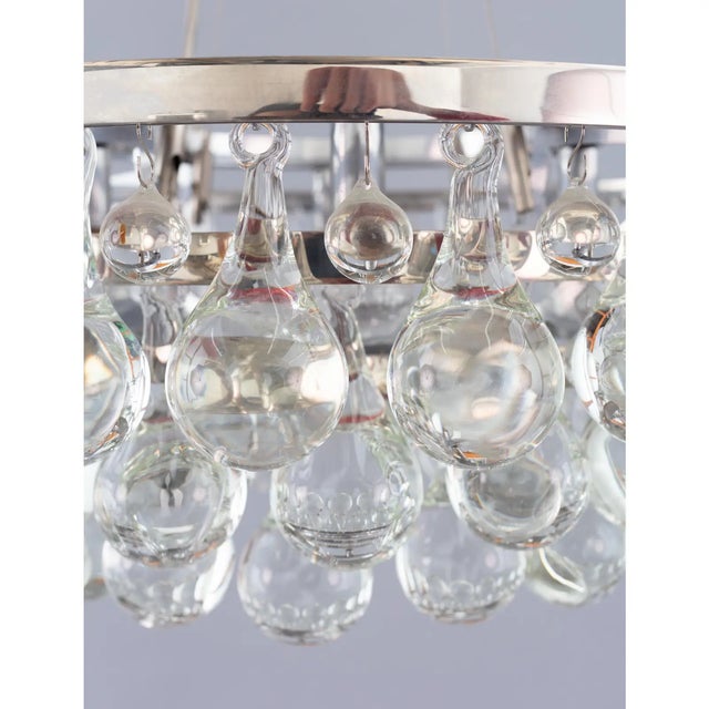 Beautiful and dramatic polished nickel frame with two tiered rim of clear glass teardrops. dimensions ø- 60cm/ 24in h-...