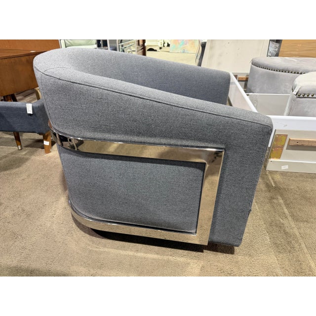 Understated yet refined, the Restoration Hardware Reginald swivel club chair embodies modern comfort with tailored...